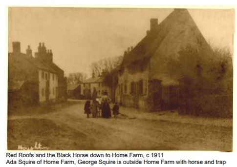 Main St. 1920—note the removal of the hedge to start construction of the village hall